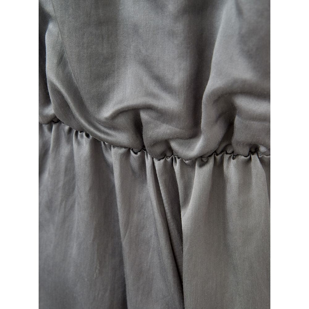 A gray silk casual dress with a gathered waist and pleated skirt