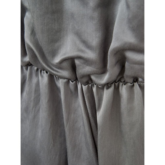 A gray silk casual dress with a gathered waist and pleated skirt