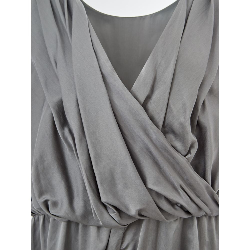 A gray silk casual dress with a V-neckline and draped sleeves