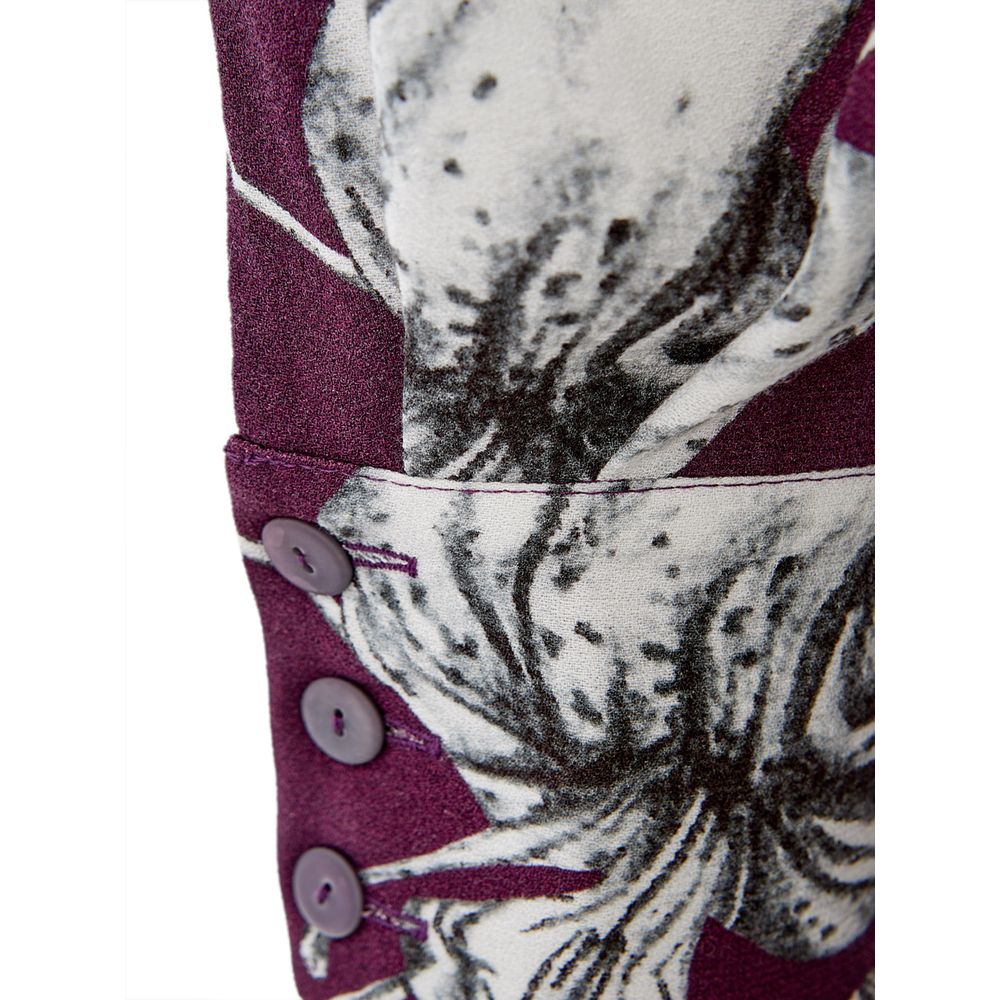 A purple viscose casual dress with a floral pattern on the front, featuring two buttons and a pocket