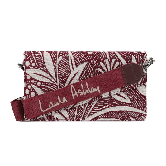 Red and black floral patterned pouch with a name tag on it