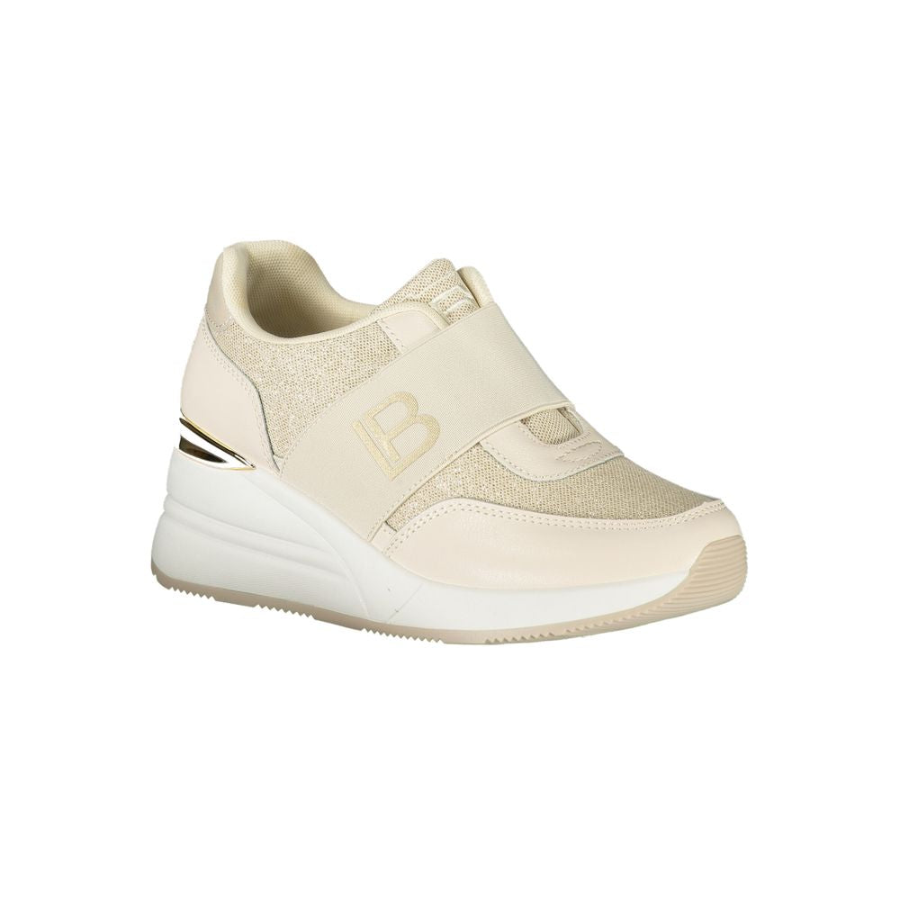 A beige women's sneaker with a logo on the side, featuring a polyurethane upper and a white sole
