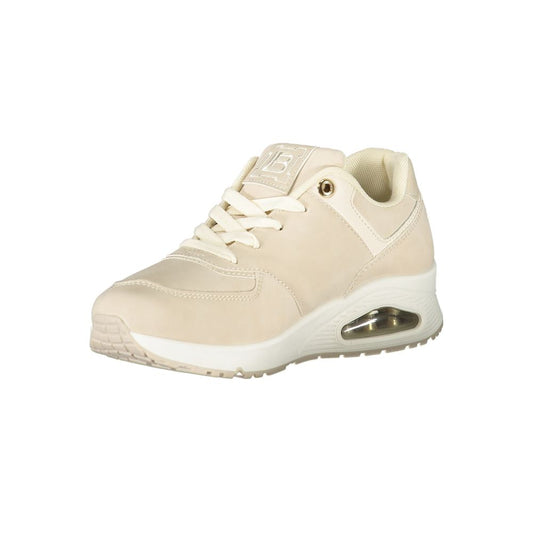 A beige women's sneaker with a lace-up front and a low heel