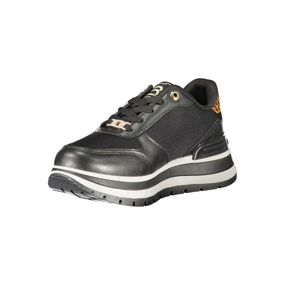 A black women's sneaker with white sole, laces, and logo detailing