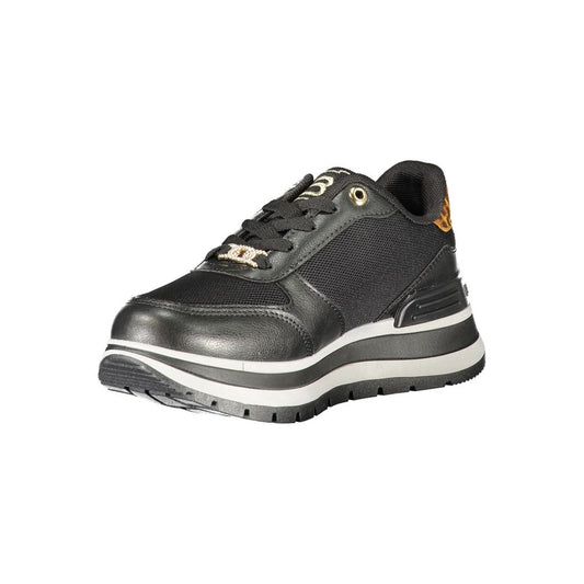 A black women's sneaker with white sole, laces, and logo detailing