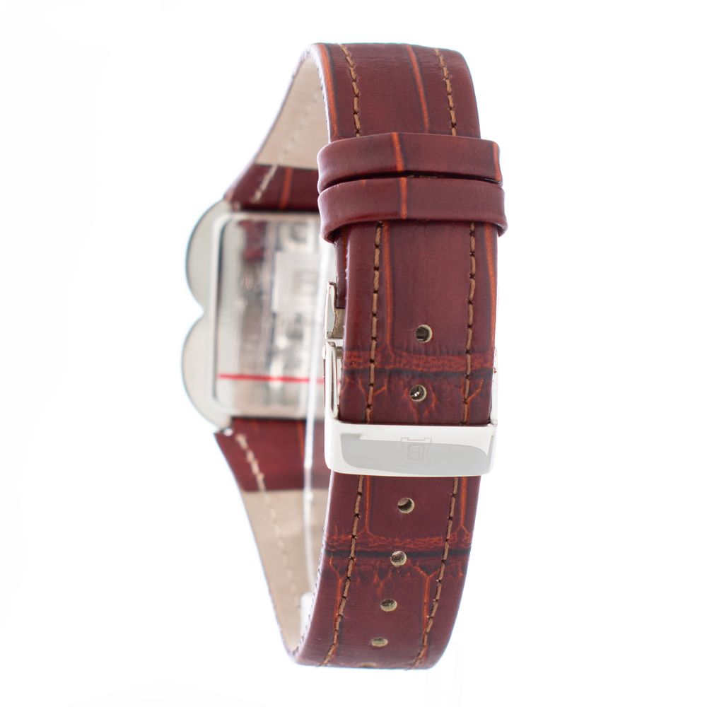 A brown leather watch with a silver face and white hands