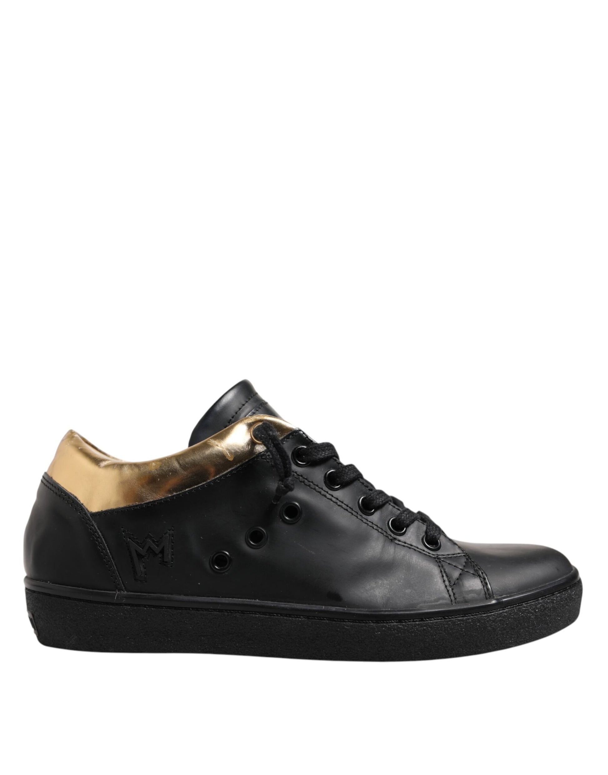 Black sneaker with gold accents on sole