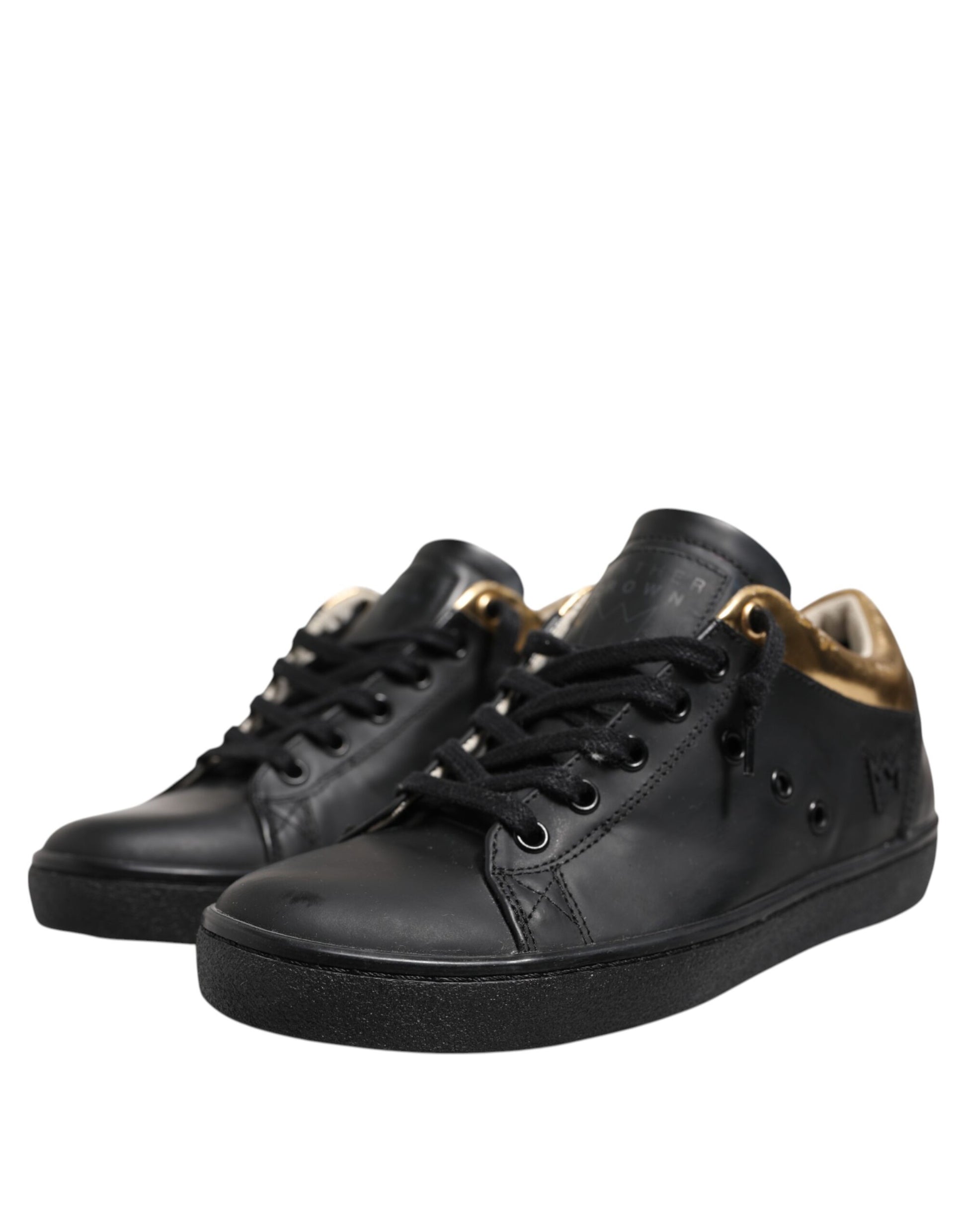 Black sneakers with gold accents