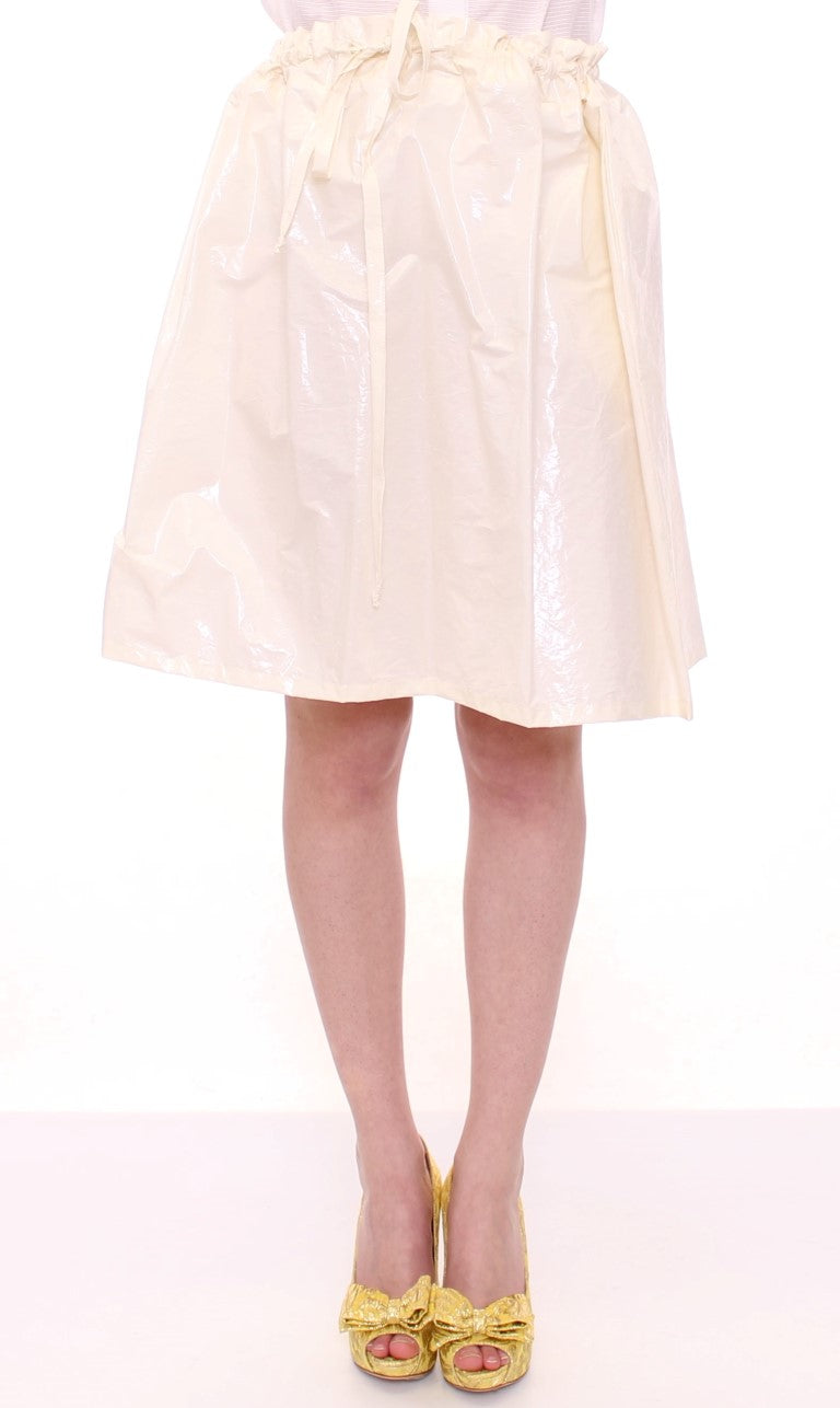 Woman wearing a skirt and gold shoes