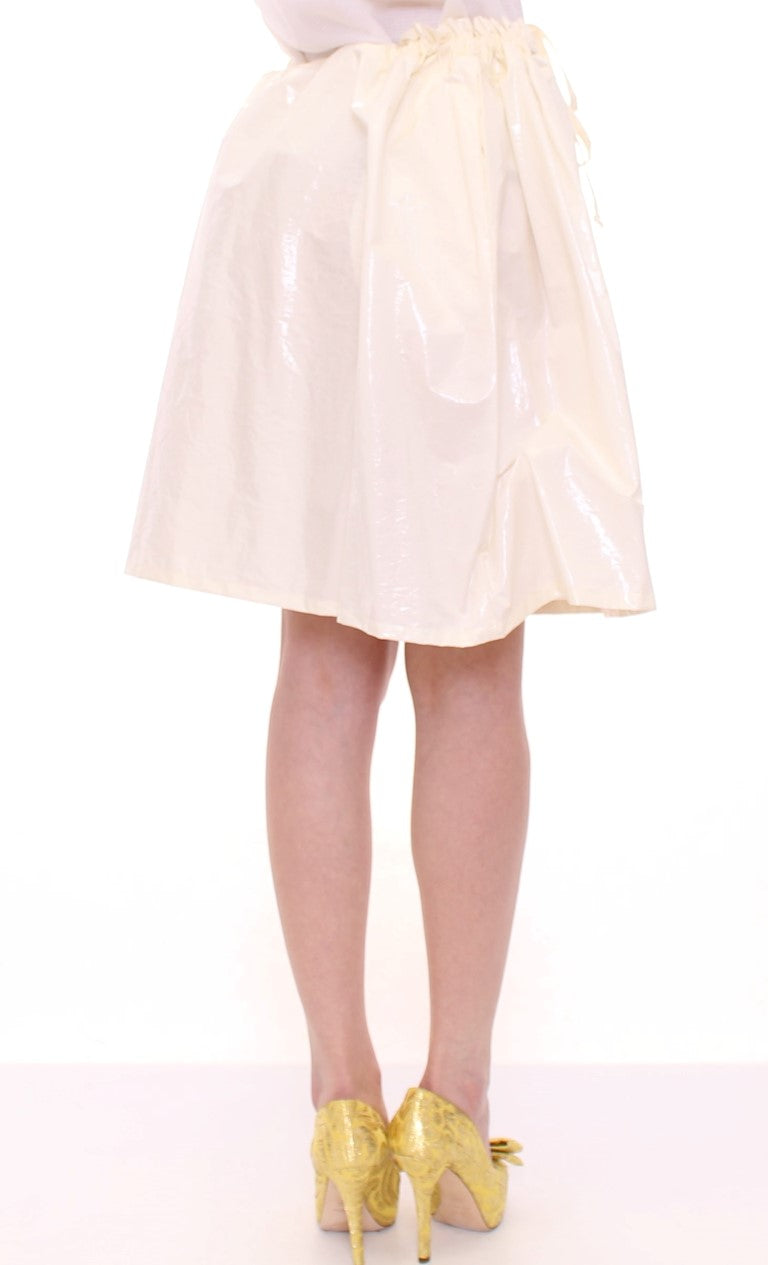 Woman wearing a skirt and yellow shoes