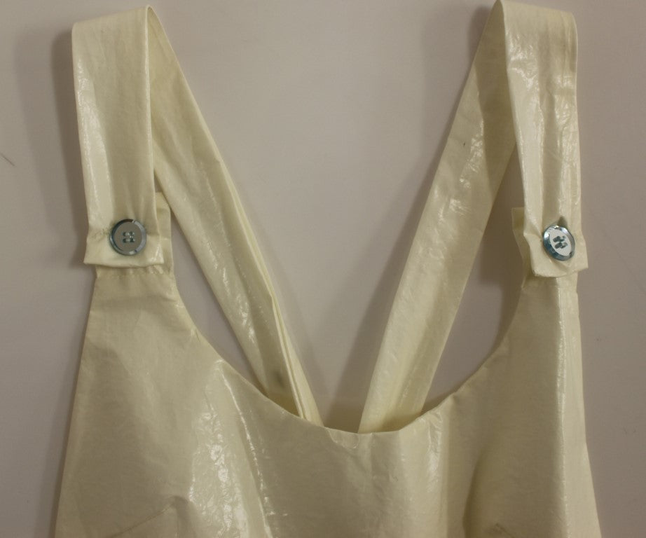Yellow plastic bag with two metal buttons on front