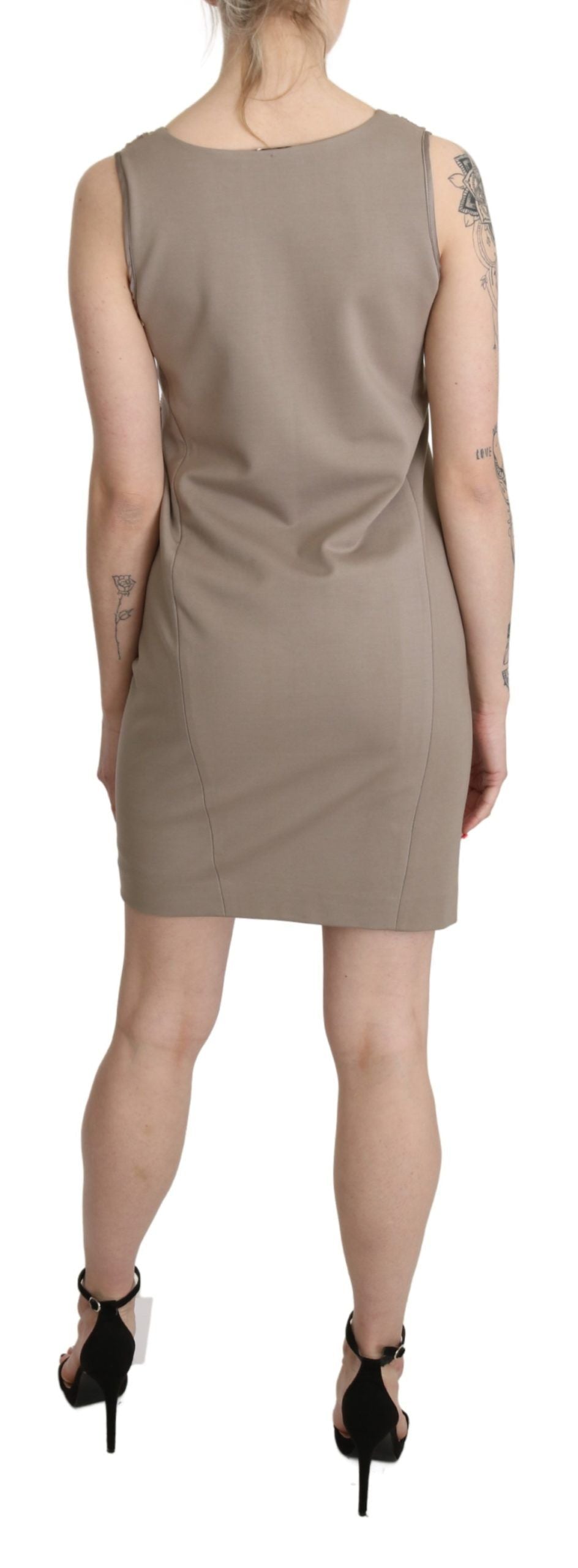 A sleeveless, sequined sheath dress with a V-neck