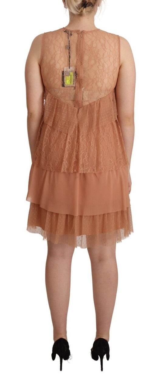 A pink lace sleeveless mini shift dress with layered design