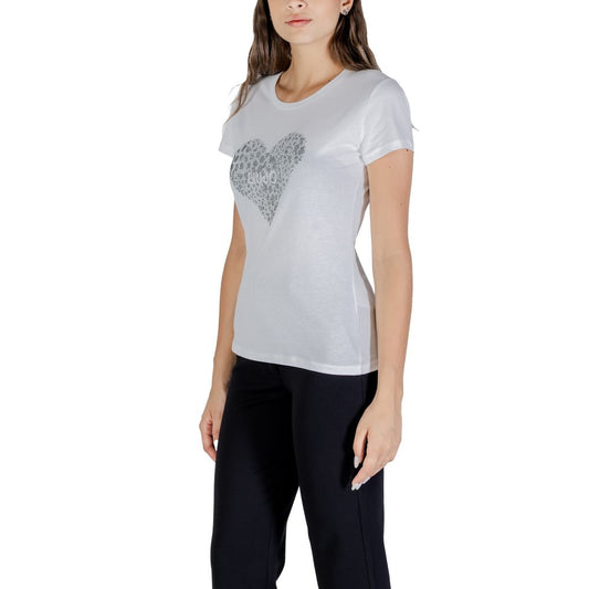 Woman wearing a white t-shirt with heart design