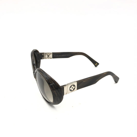 Sunglasses with gold accents on arms