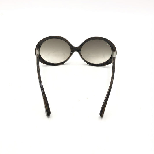 Sunglasses with a black frame and silver lenses