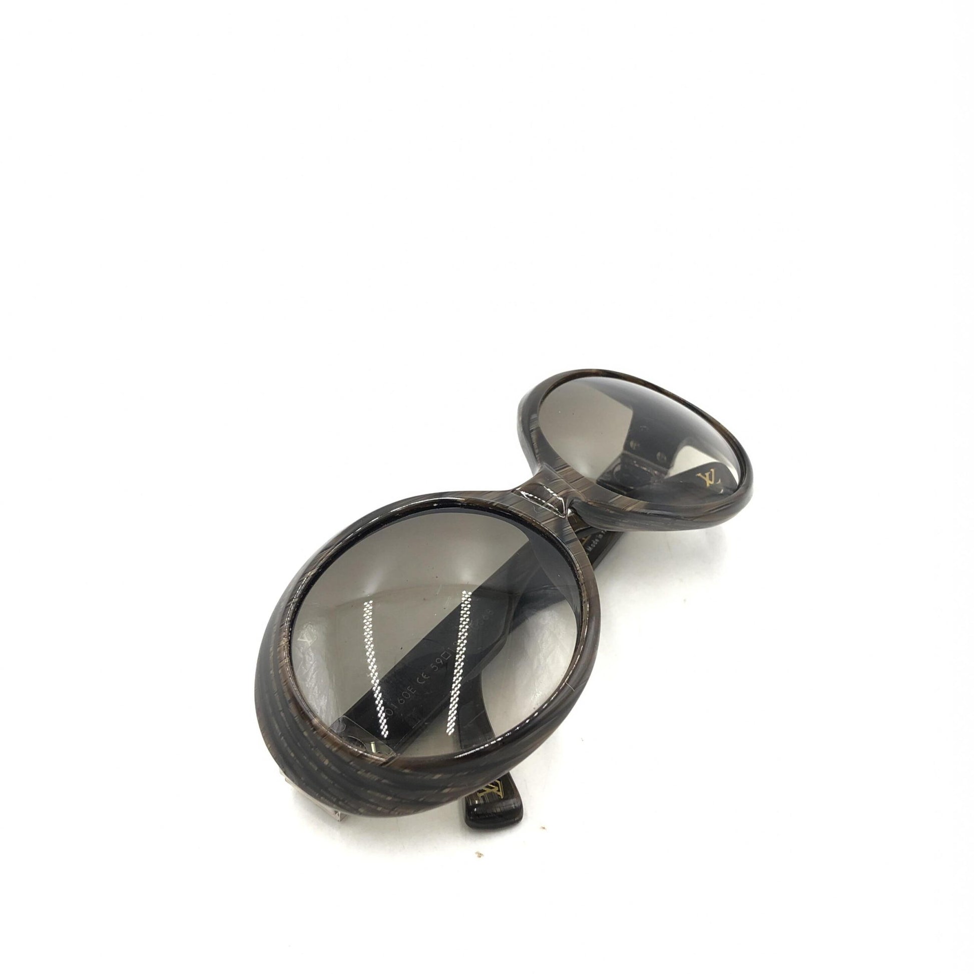 Pair of round sunglasses with black frame and clear lenses