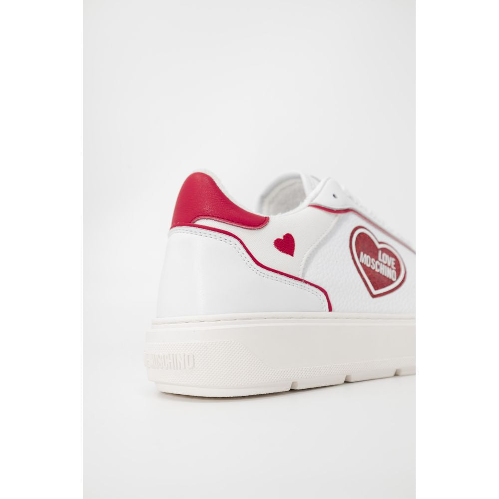 Red and white sneakers with heart logo on side