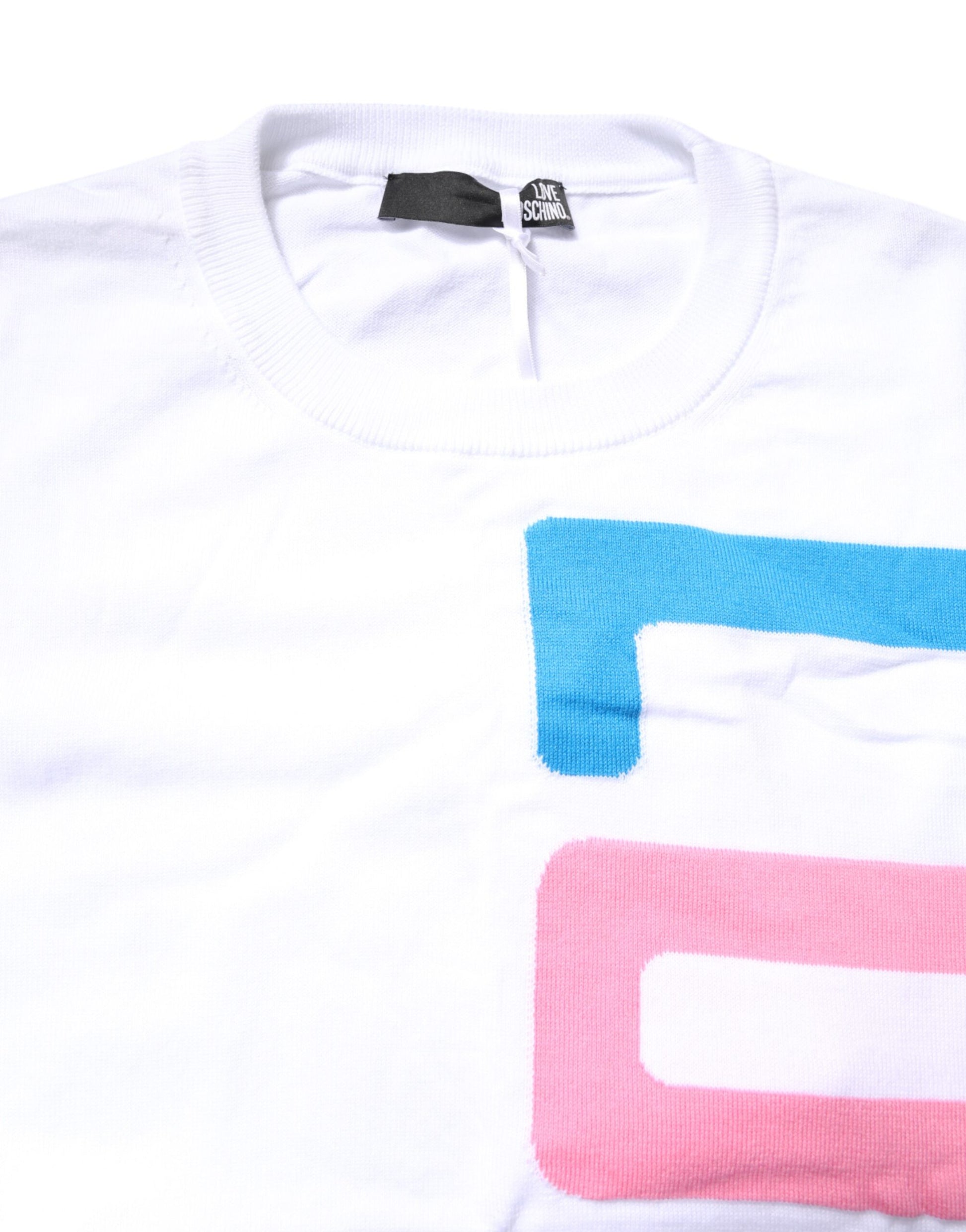 White t-shirt with colorful letters on front