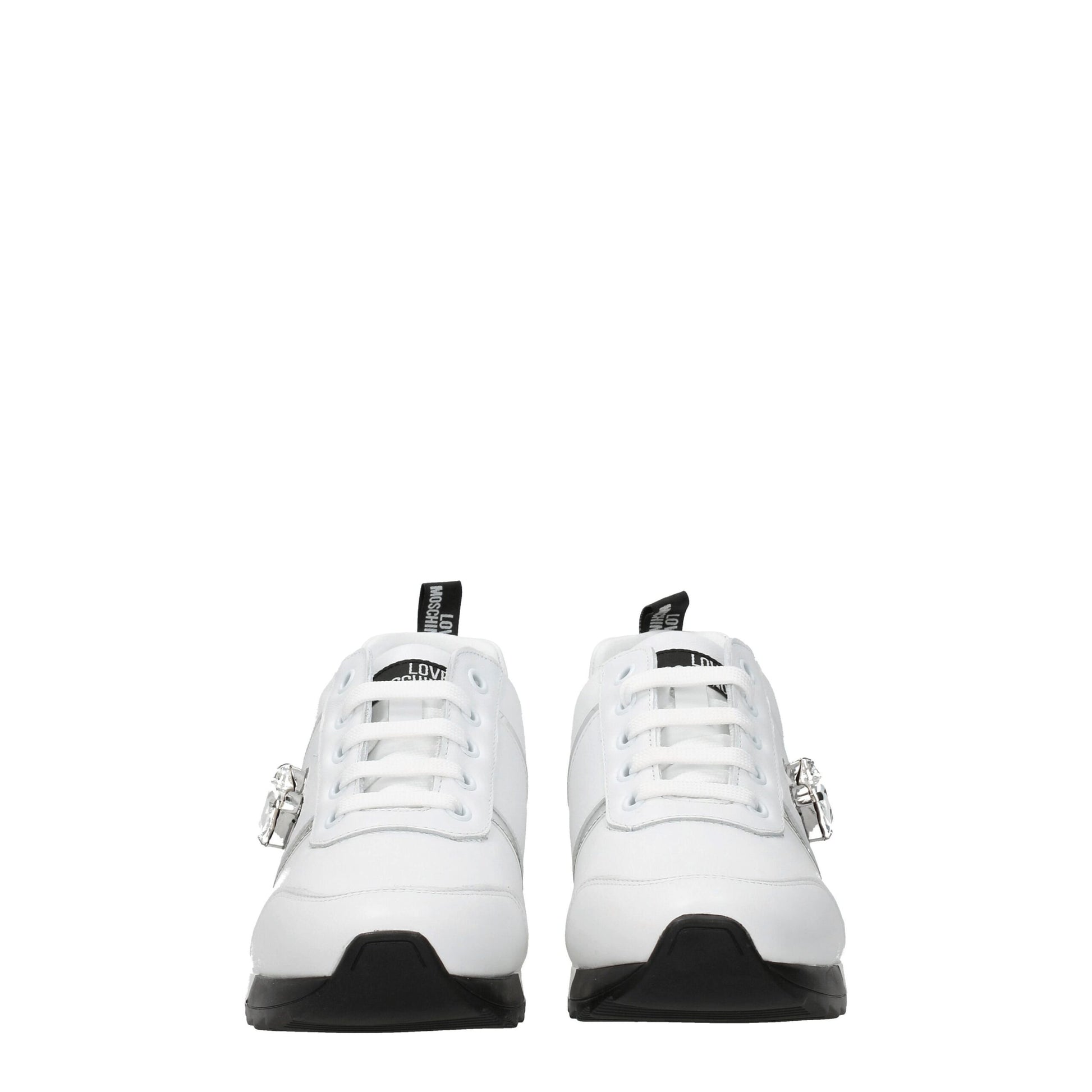 Pair of white leather low top sneakers with black laces, featuring a logo on the side and a buckle closure