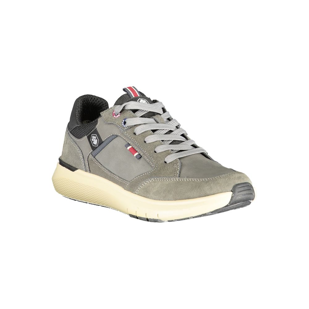 A gray and yellow men's sneaker with laces, a rubber sole, and a textured upper