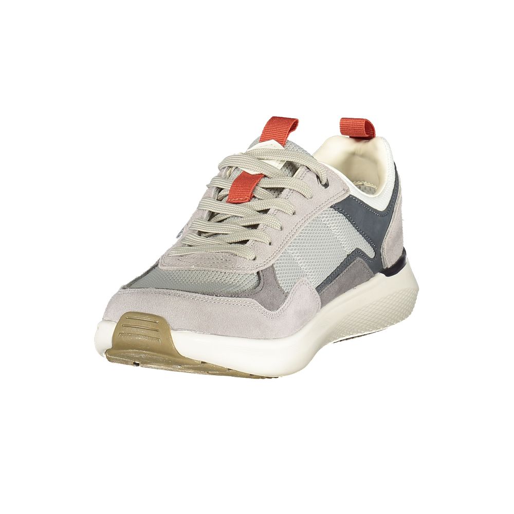 A gray sneaker with red accents, designed for men
