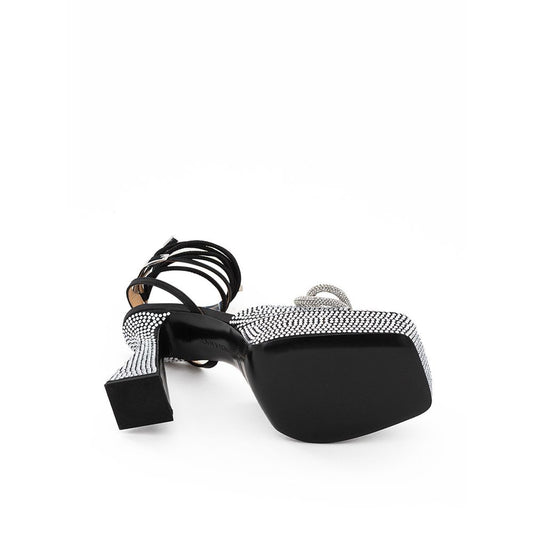 Pair of sunglasses with black frame and patterned lenses