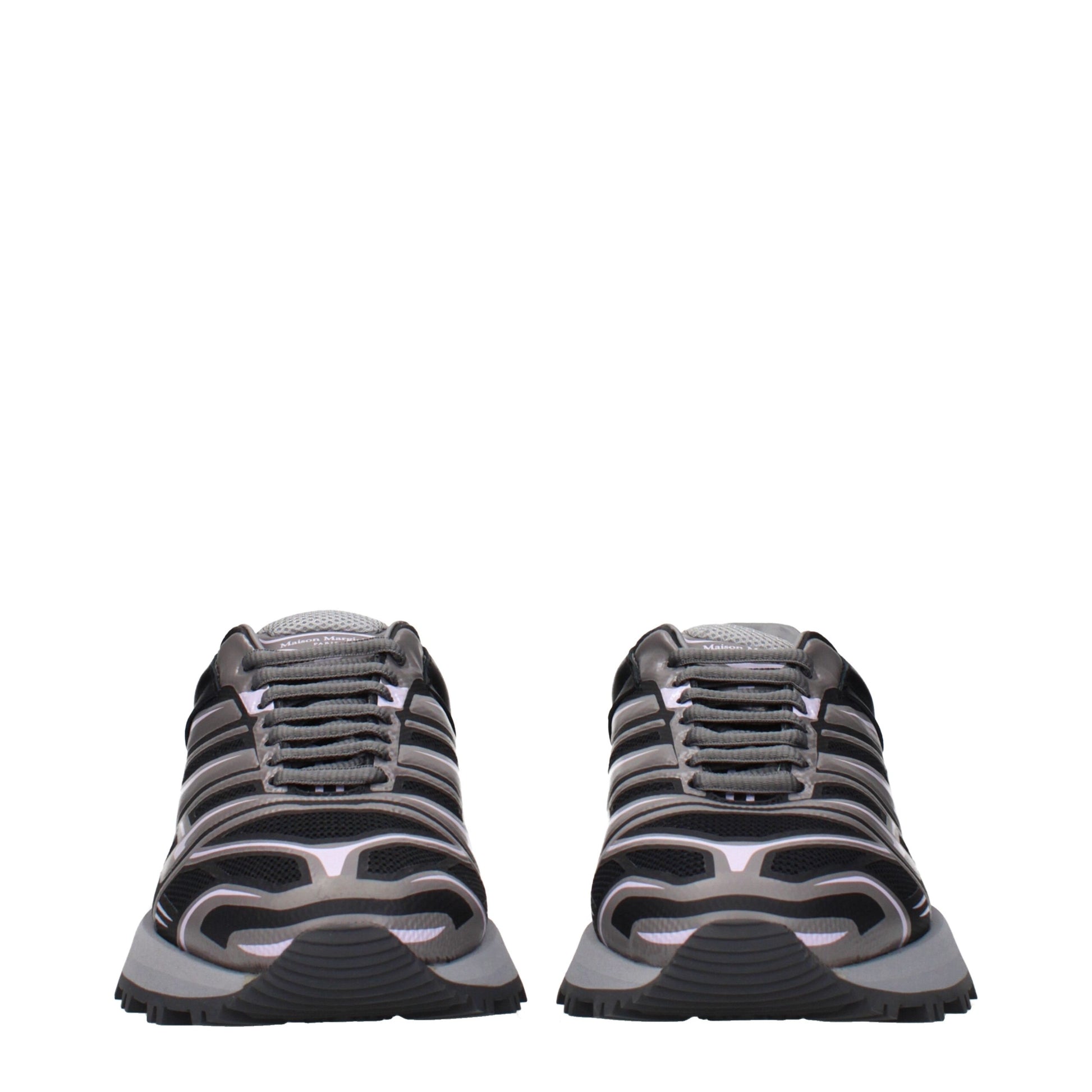 Pair of black athletic sneakers with white soles