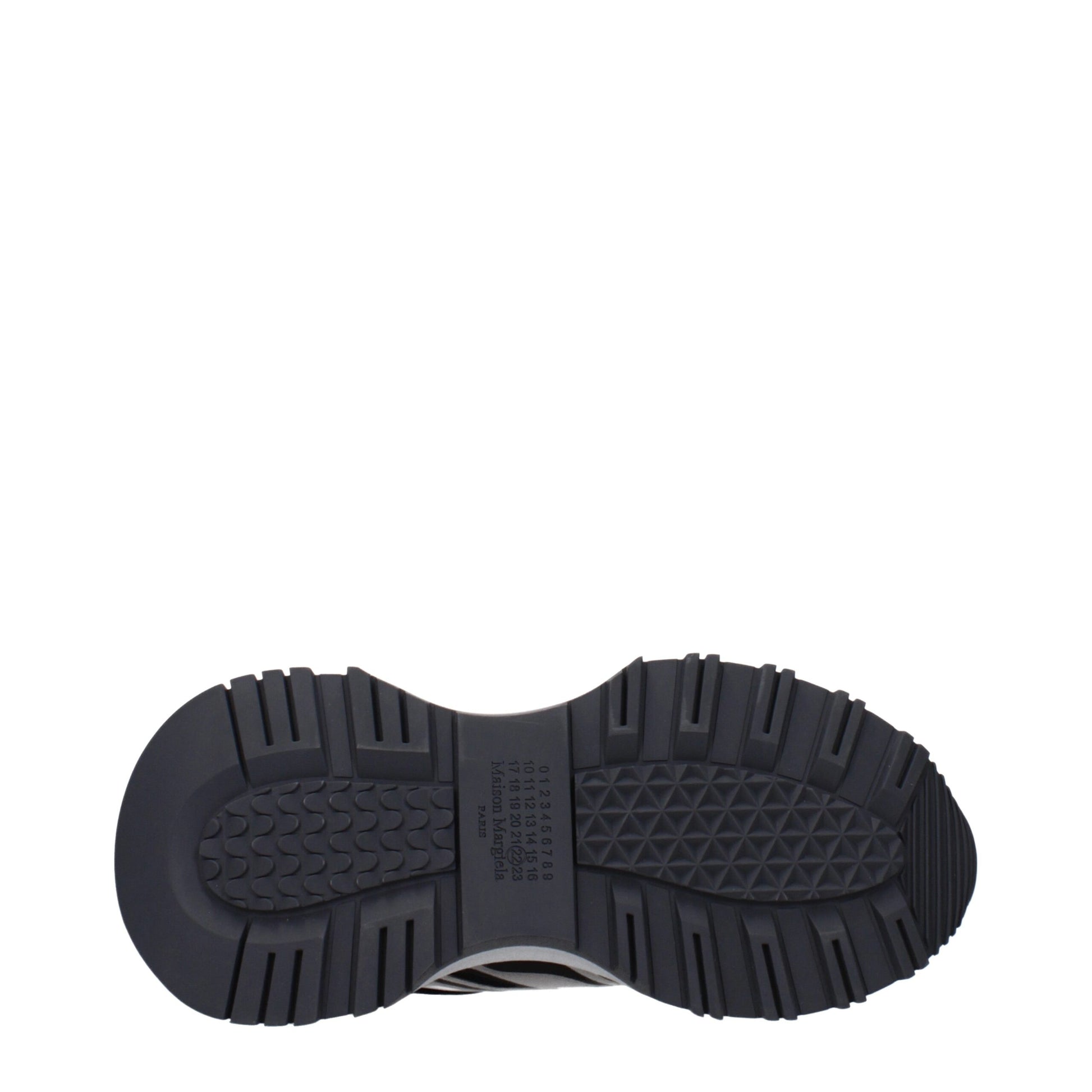 A single black athletic shoe with a textured sole, featuring a brand logo on the side and a pull tab at the back