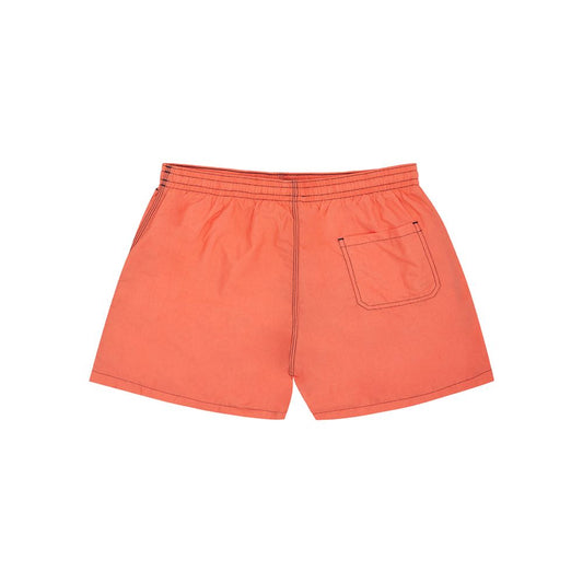 Pair of orange shorts with pocket on left leg