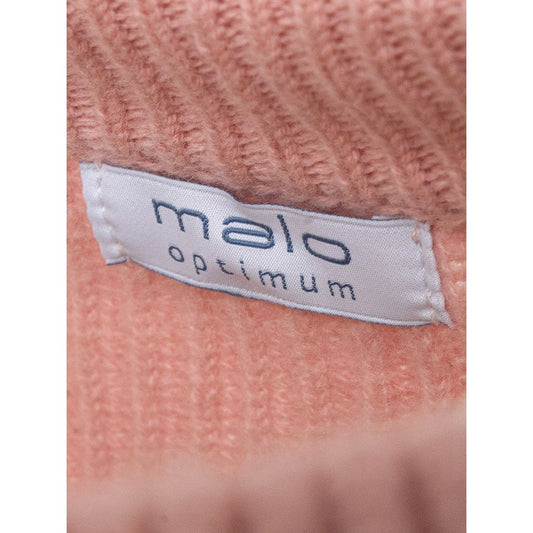 Pink knit sweater with brand label on inside collar