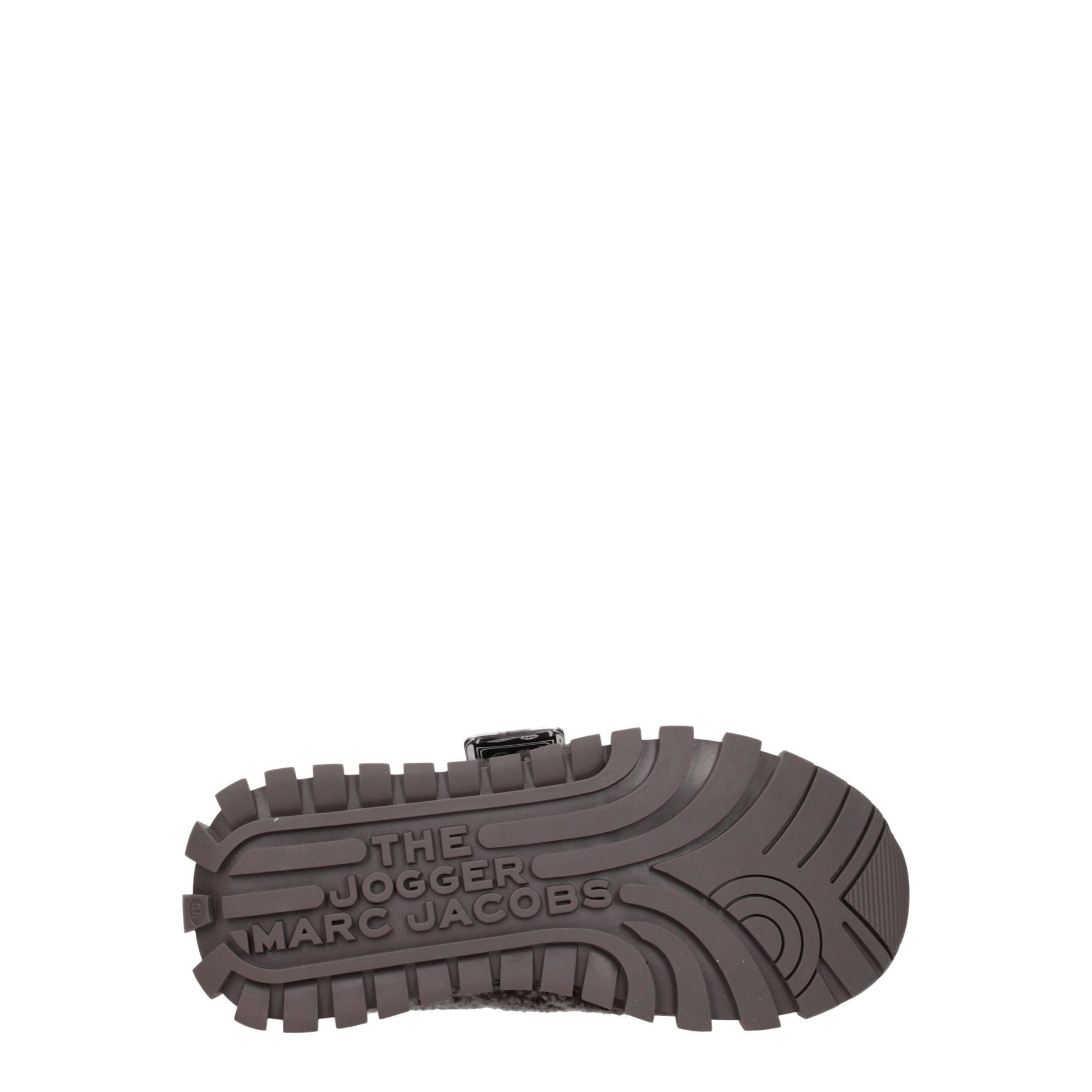 A single shoe from the Marc Jacobs brand, featuring gray fur on the upper and chunky soles