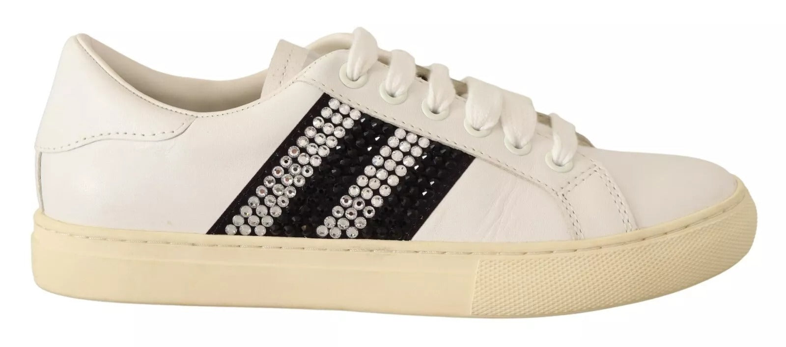 White sneakers with black stripes and a pattern on the side