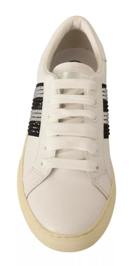 White sneaker with black stripe on side