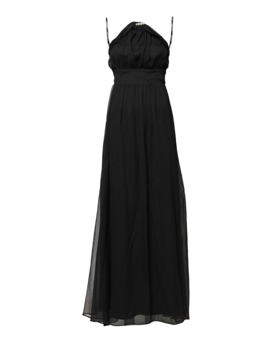 A long black tulle dress with pearl accents and sleeveless design