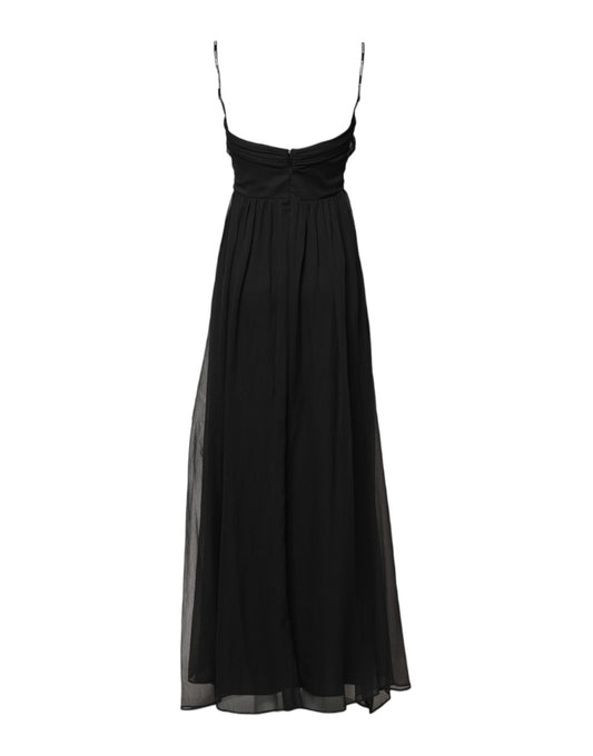 A long black tulle dress with pearl accents and sleeveless design