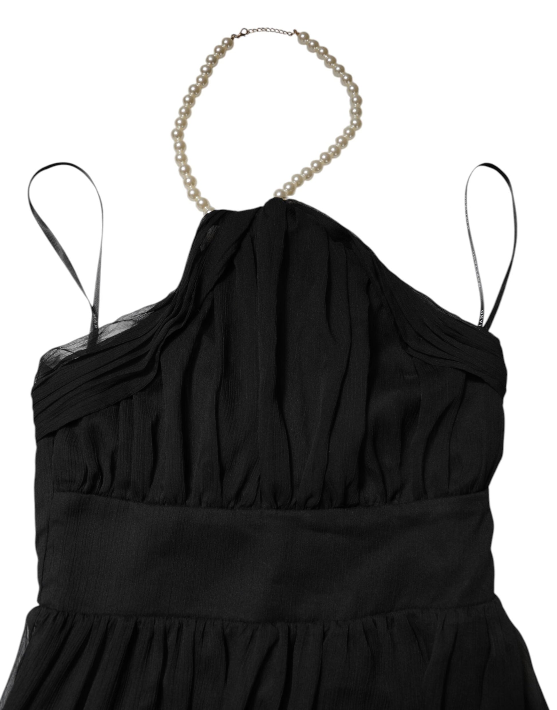 A black tulle sleeveless long gown dress with pearl neckline