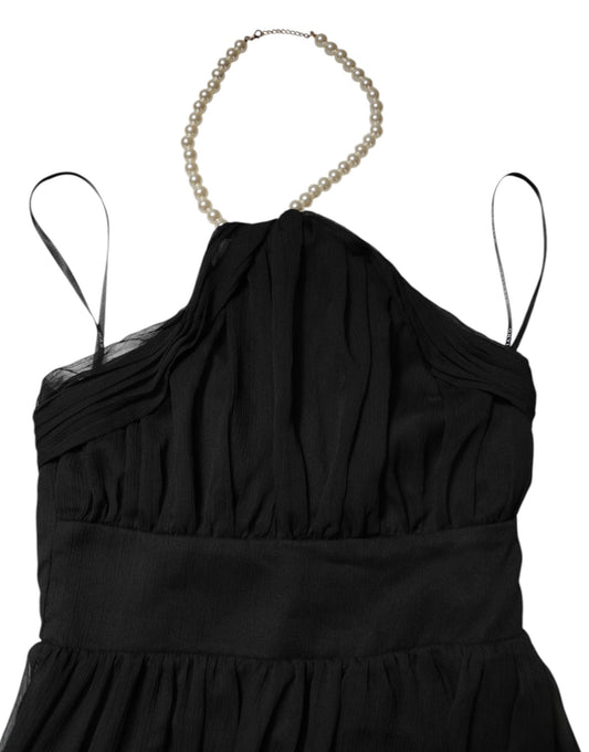 A black tulle sleeveless long gown dress with pearl neckline