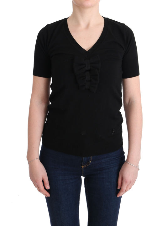 Black long sleeve shirt with bow tie detail on front