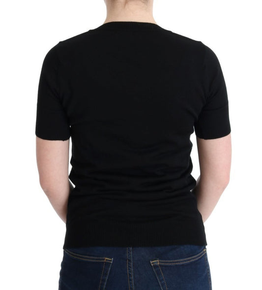 Black short sleeve shirt on a person