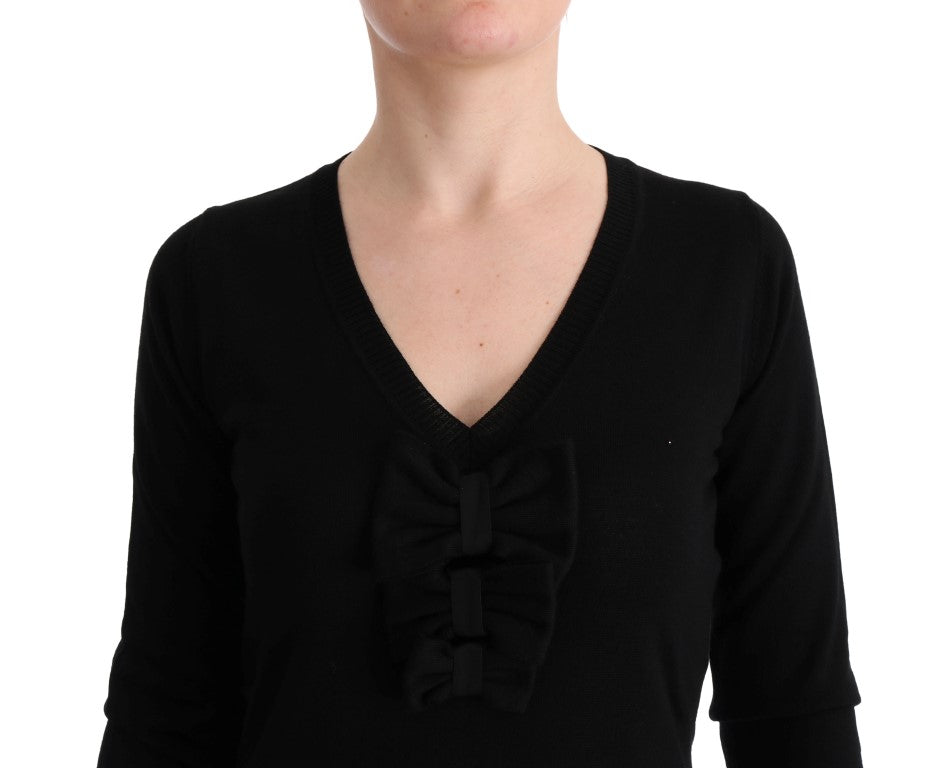 Black long sleeve sweater on a person
