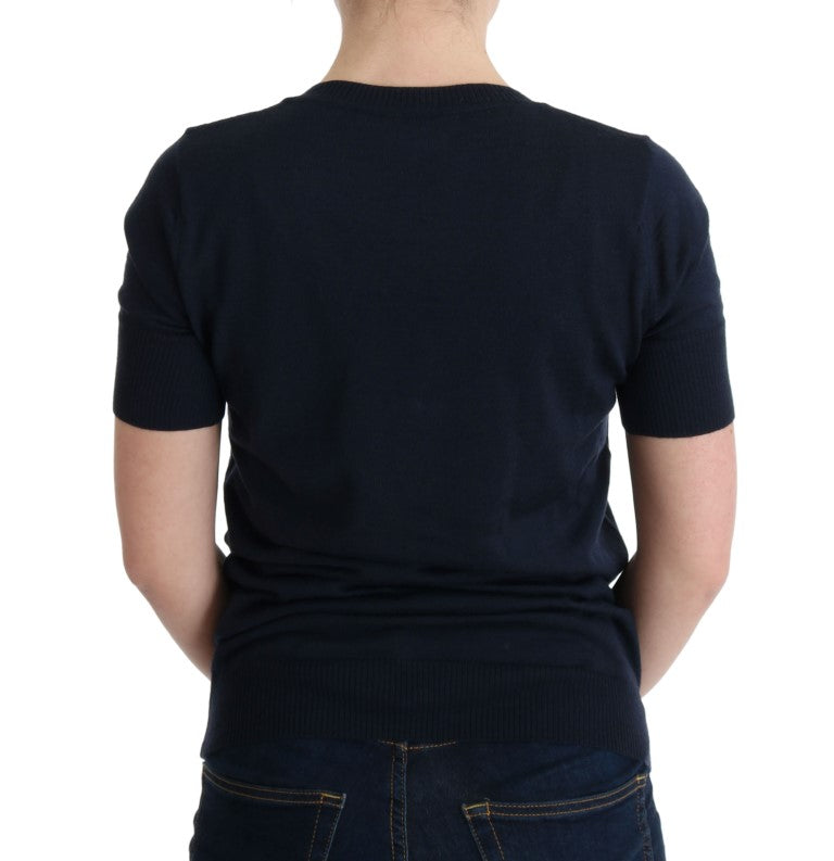 Woman wearing dark blue sweater and jeans