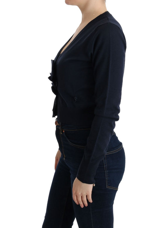 Woman wearing a dark blue long sleeve shirt and jeans