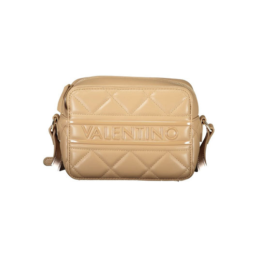 Small tan leather handbag with quilted design and brand name embossed on front