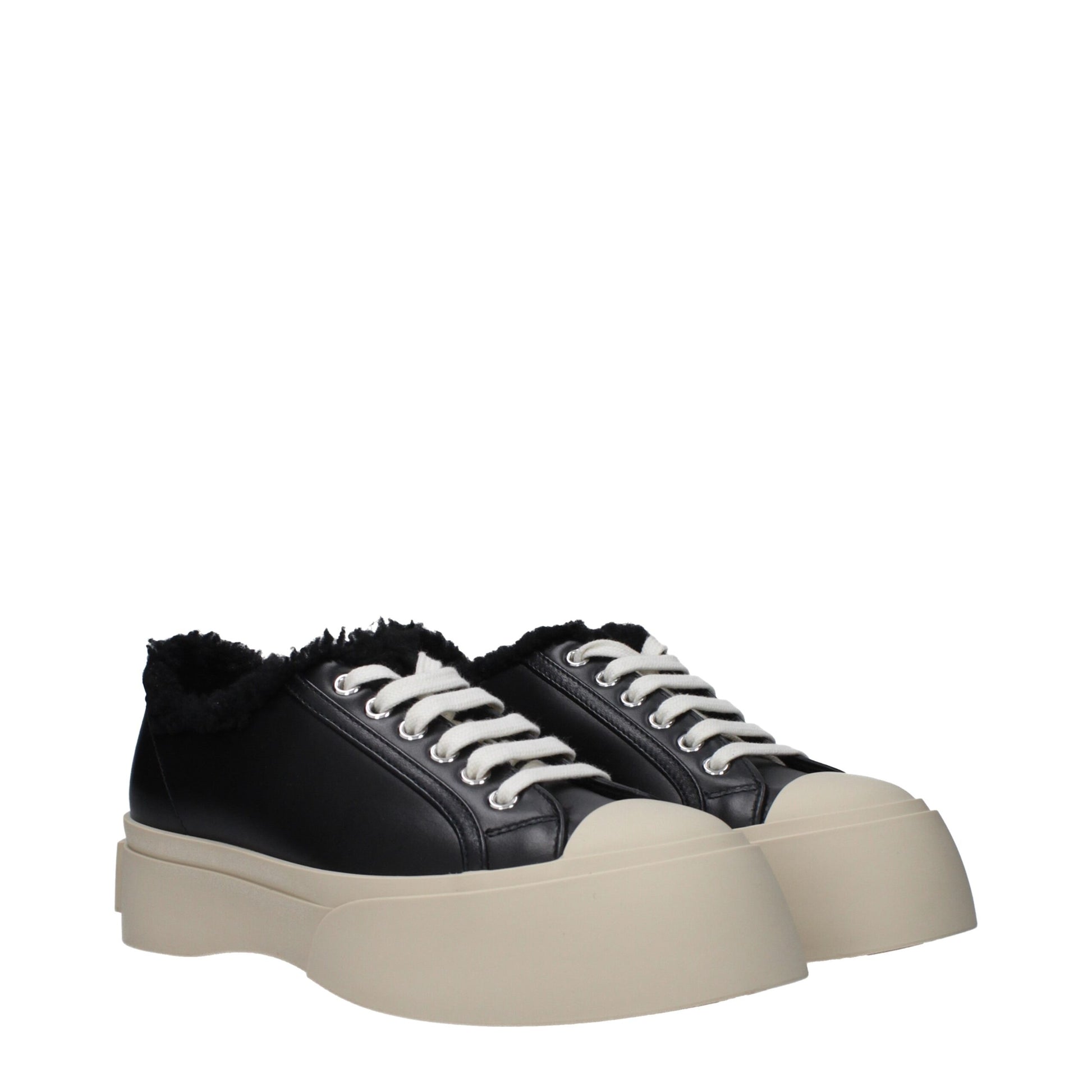 Pair of black leather chunky sneakers with white laces, featuring a thick sole and a fur-lined collar