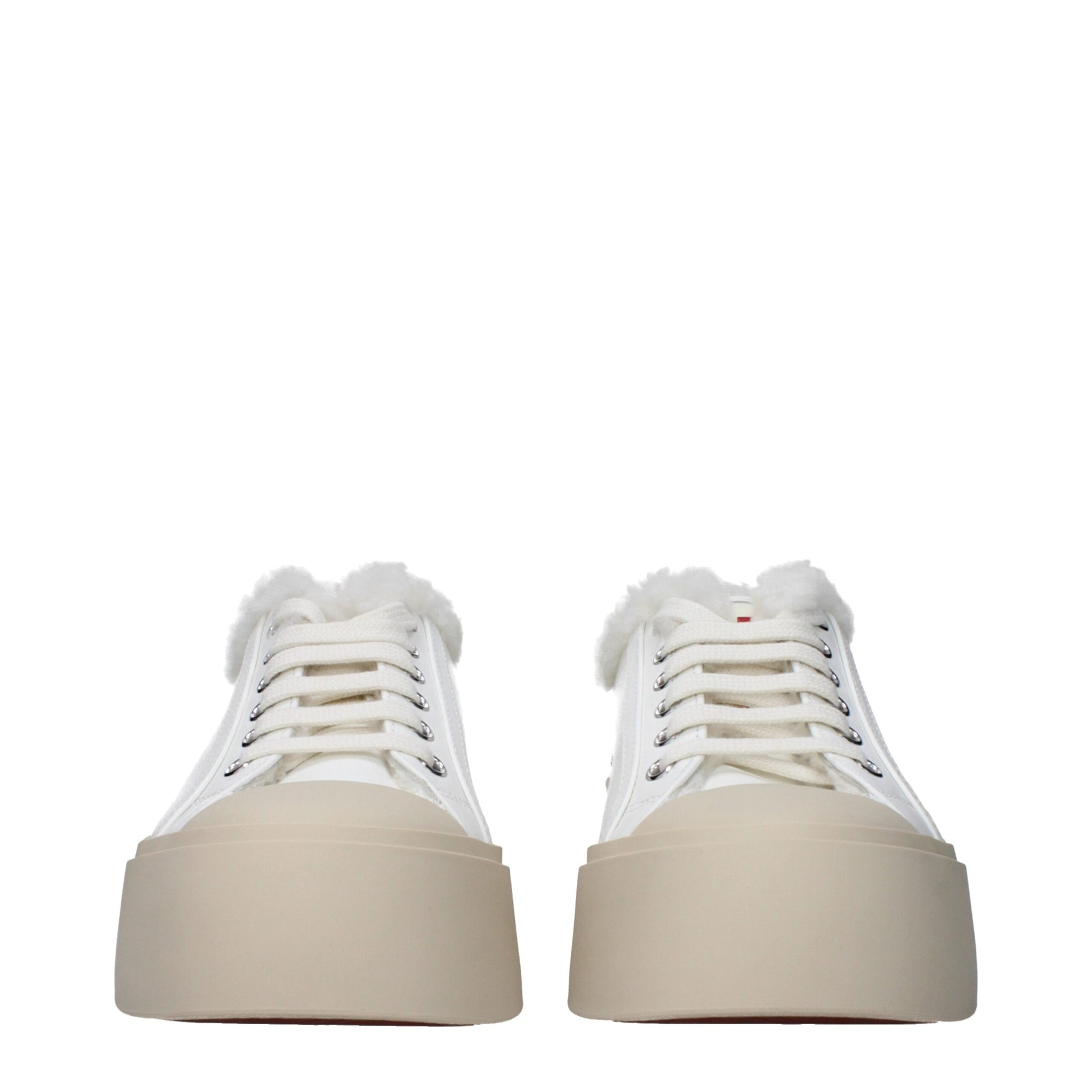 Pair of white leather sneakers with fur trim, low top, lace-up front, and chunky platform sole