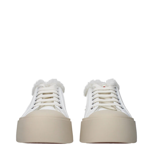 Pair of white leather sneakers with fur trim, low top, lace-up front, and chunky platform sole