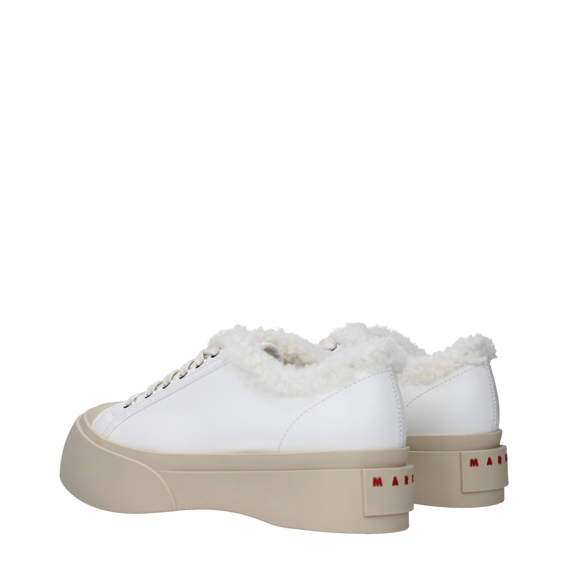 A pair of white leather sneakers with fur trim, featuring a low top design