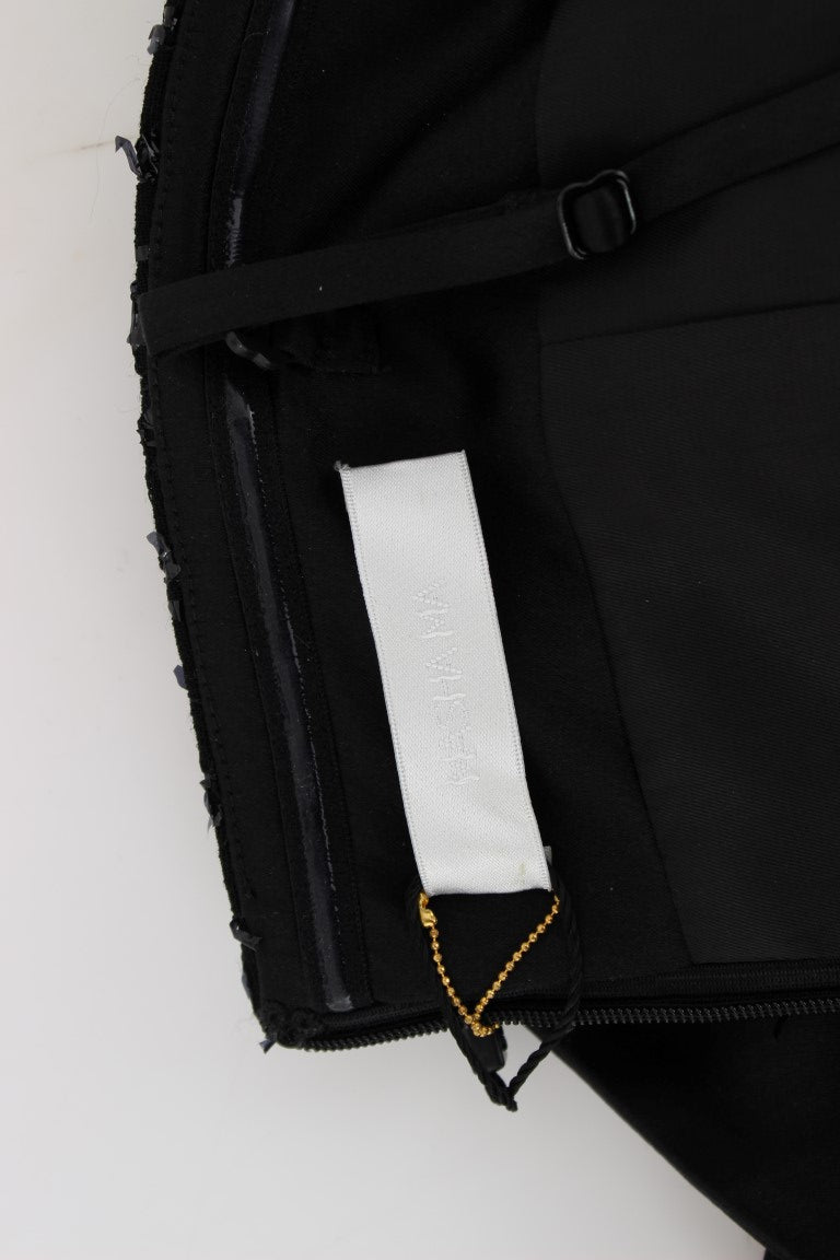 Pair of black pants with white tag on waistband