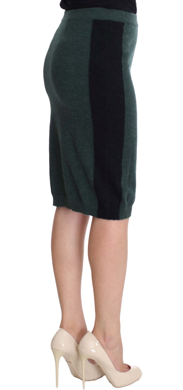 Woman wearing a green skirt and tan heels